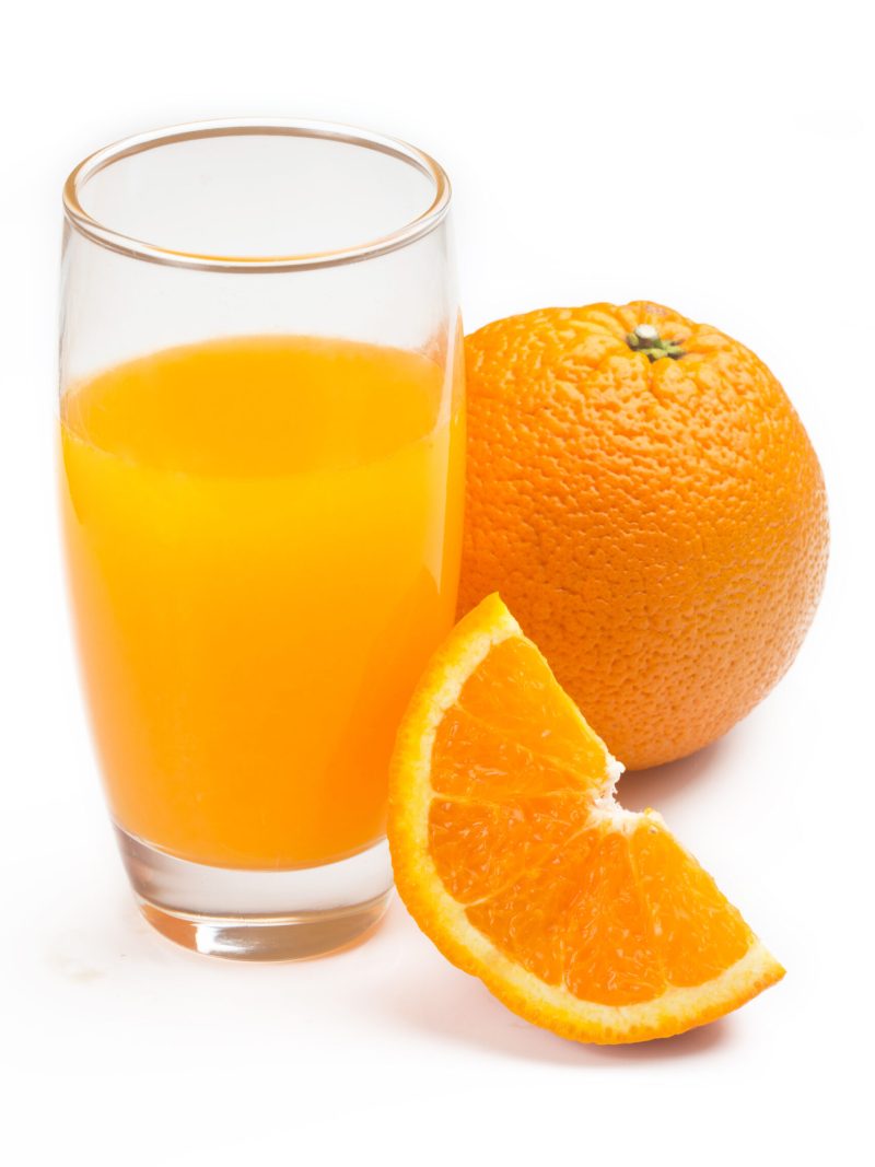 closeup of glass with orange juice, isolated on white background